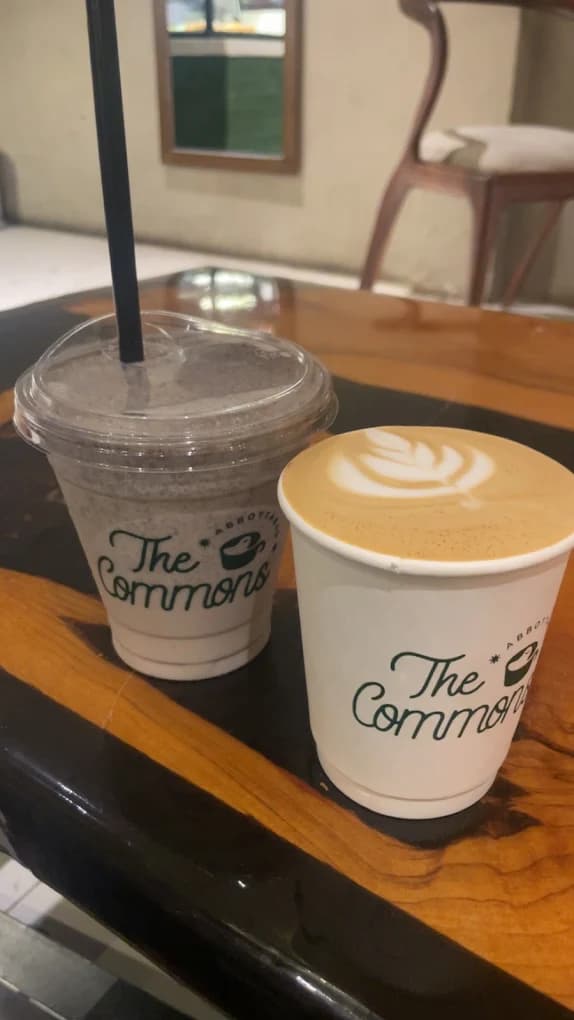 Matcha frappe and latte with leaf latte art in The Commons Coffee cups